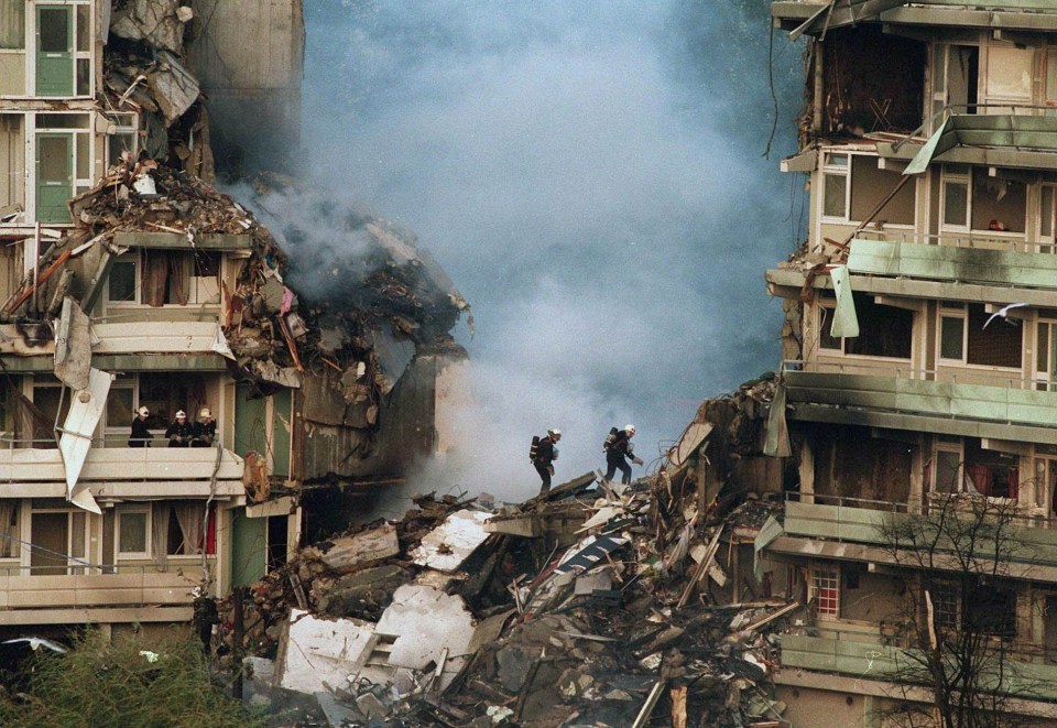 Rescue workers inspect the wreckage of the El Al 747 cargo plane