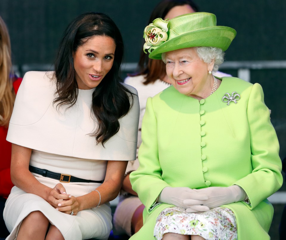 The late Queen Elizabeth II with Meghan at a ceremony to open the new Mersey Gateway Bridge on June 14, 2018 in Widnes, England.