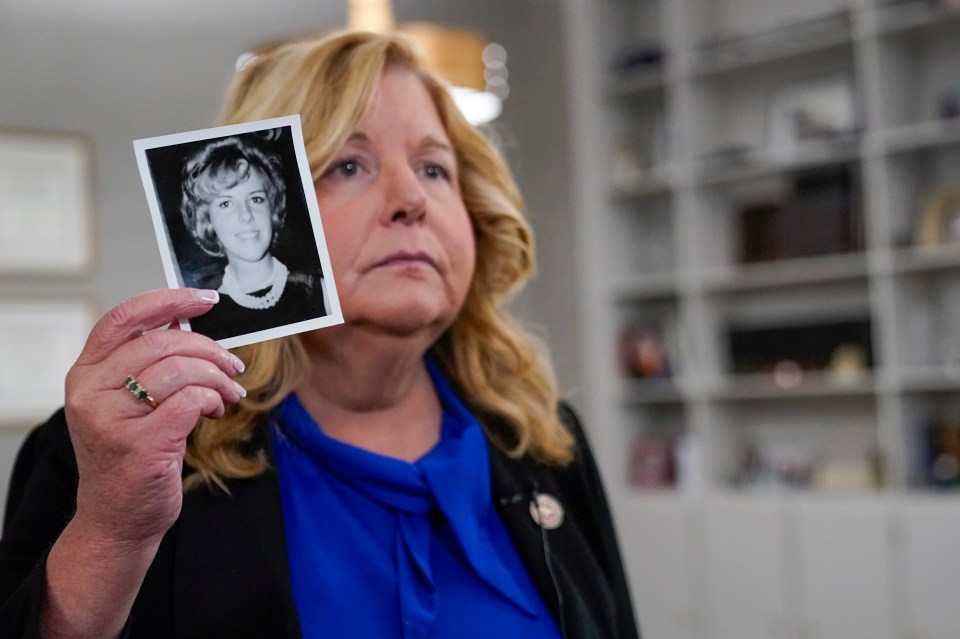 Nassau County District Attorney Anne Donnelly holds a photo of victim Diane Cusick