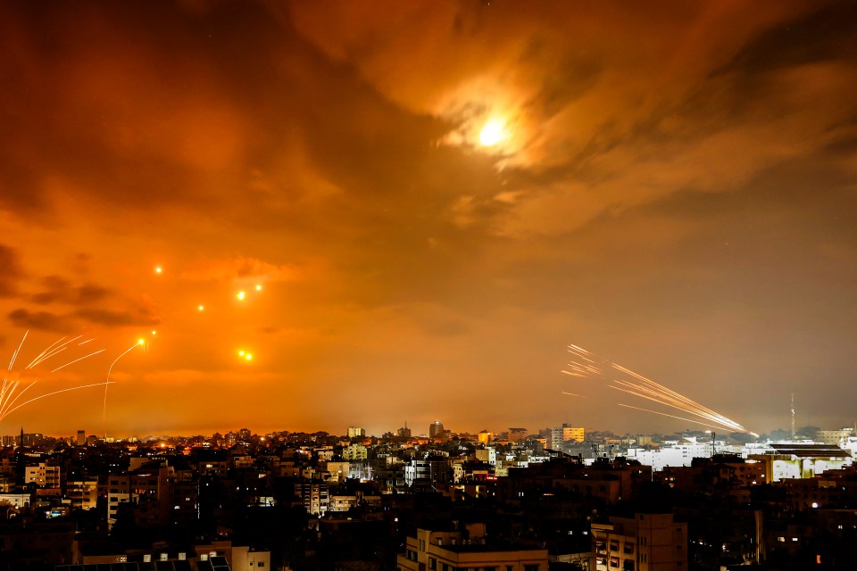 Rockets fired by Palestinian militants from Gaza City are intercepted by the Israeli Iron Dome defence missile system in October