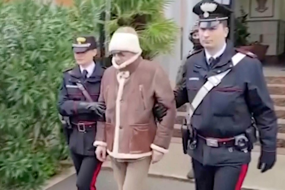 Matteo Messina Denaro being escorted from a Carabinieri police station shortly after his arrest last year