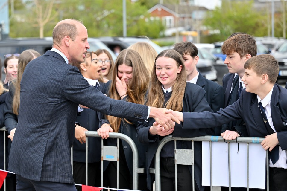 The royal shook hands with thrilled pupils excited to meet their prince