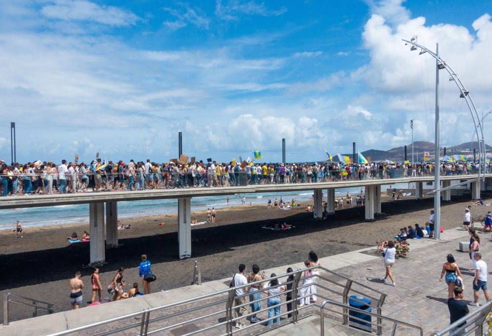 Demonstrators line up on a bridge in Gran Canaria yesterday