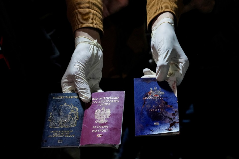 Bloodied UK, Polish & Australian passports were found in the wrecked cars