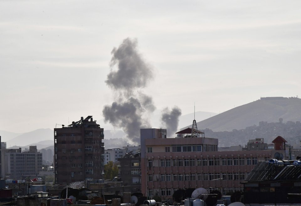 Smoke rises after an attack on the building of the Iranian Consulate in Syria