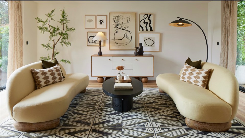 The open plan living room and kitchen has full height glazing on two sides