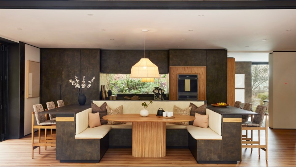 a kitchen with a wooden table and benches