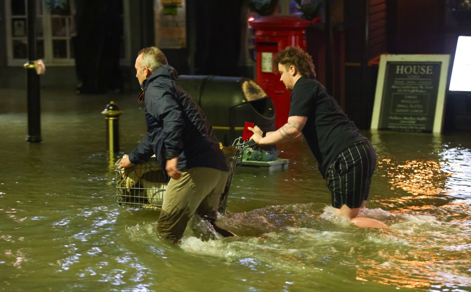 Residents evacuate their belongings via a shopping trolley, Cowes, Isle of Wight