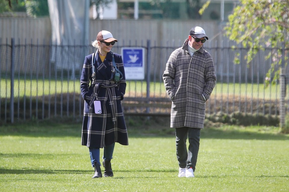 The pair wore matching taran Barbour coats on their dog walk