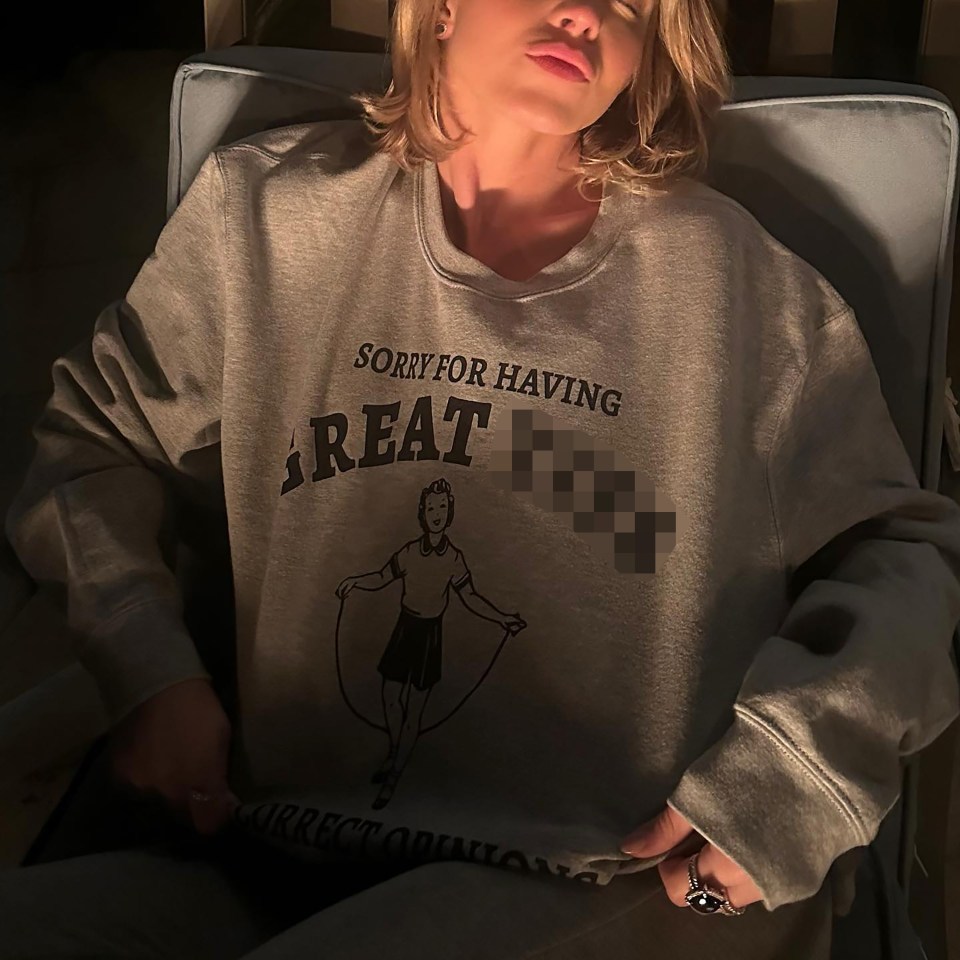 The actress posed in a grey jumper with the slogan: ‘Sorry for having great t**s and correct opinions’