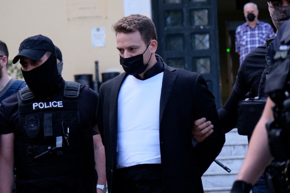 Anagnostopoulos pictured leaving court while escorted by police