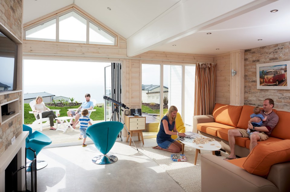 Beach houses have a private patio with hot tub