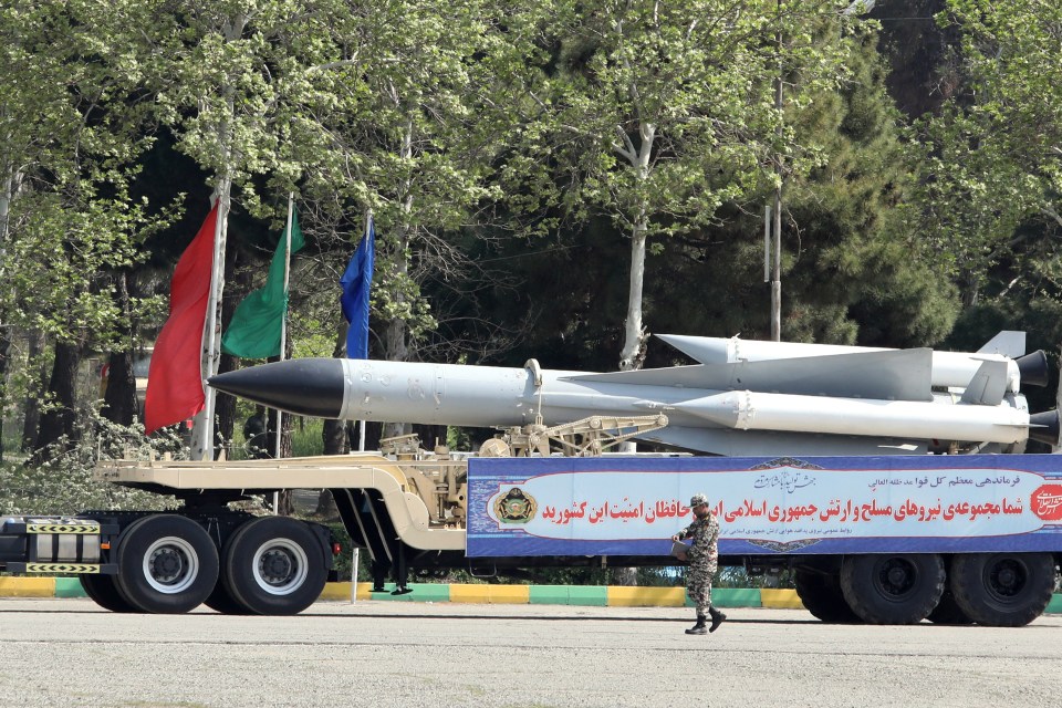 An Iranian military truck carries missiles during the parade in Tehran