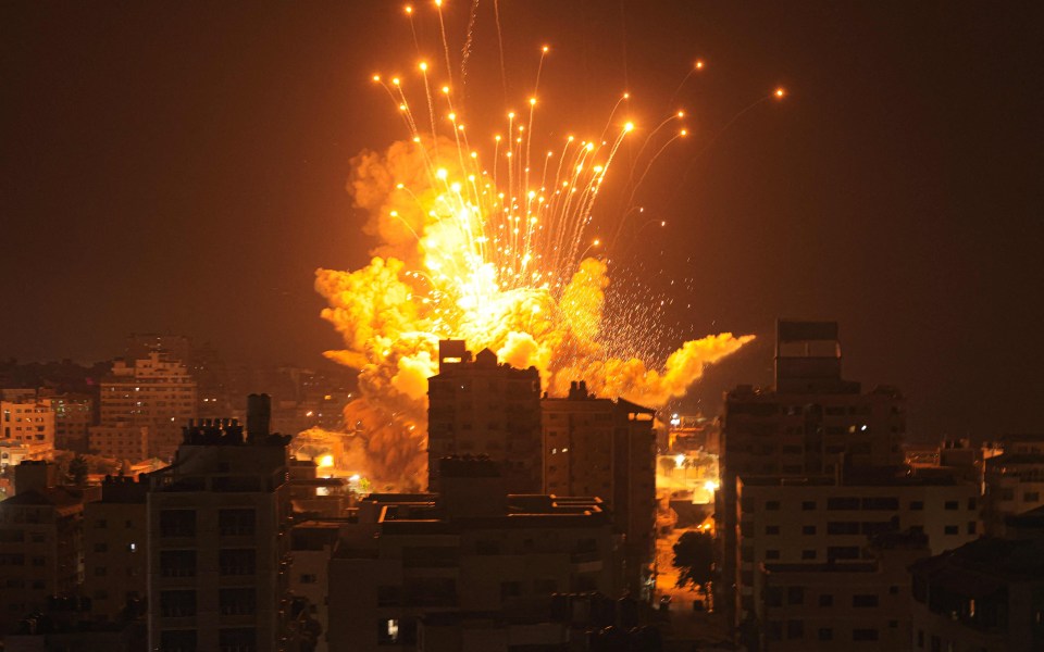 Fire and smoke fill the sky after an airstrike in Gaza