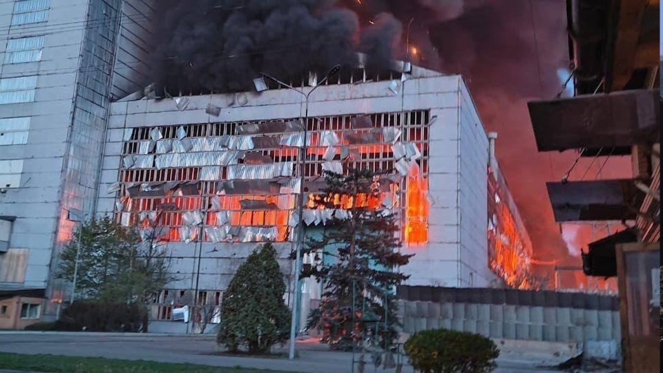 The powerplant pictured in flames following the airstrikes