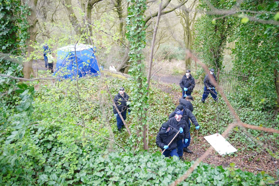 Police officers carry out searches to find more human remains