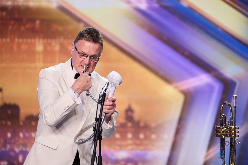 Entertainer Dennis Frere-Smith puts his trumpet to one side to toot on a shower head in the episode