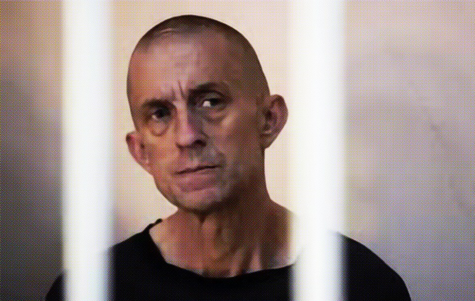 Shaun behind bars in a courtroom in Donetsk in June 2022