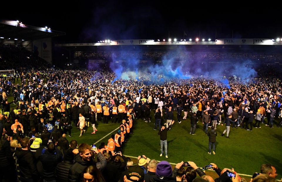 Supporters engulfed the pitch in celebration