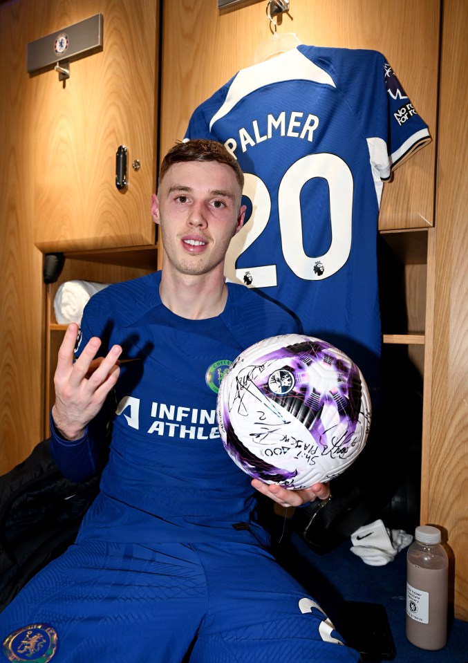 Cole Palmer poses with the match ball after scoring a hat-trick