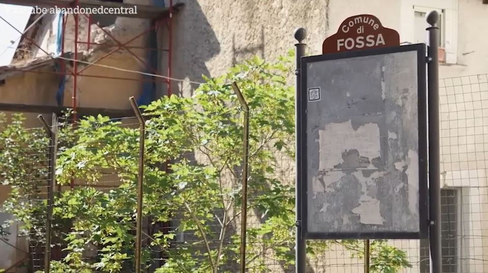 An old town sign has rusted away following years of neglect