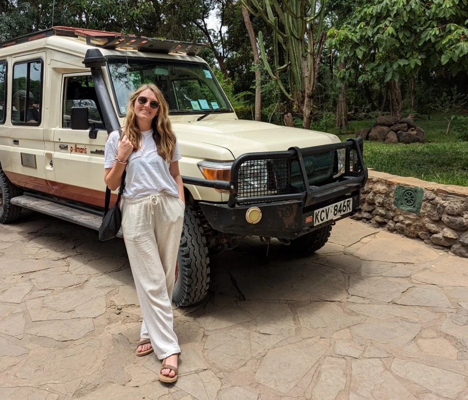 Kara Godfrey with a safari Jeep