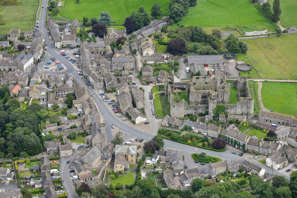 The waterfall is described as a hidden gem because it's not easy to spot in the village