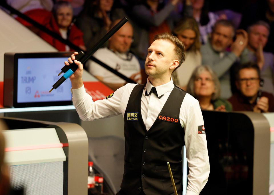 Judd Trump celebrates his opening round victory