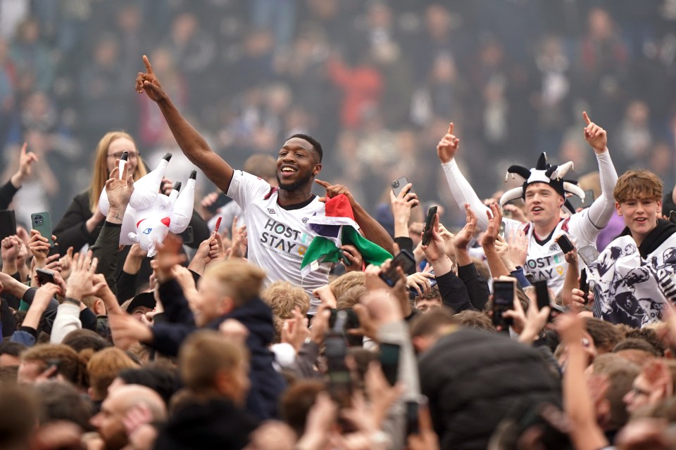 Ebou Adams celebrates with delighted Rams fans