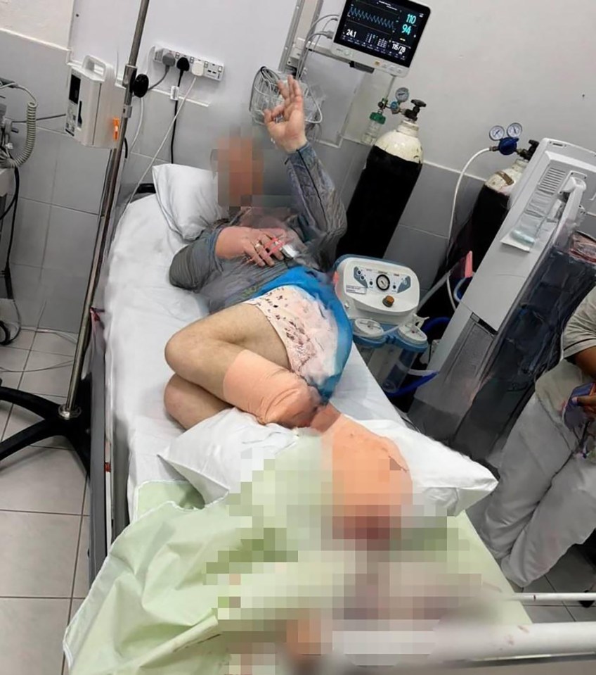 The tourist pictured in hospital after the reported ‘shark attack’