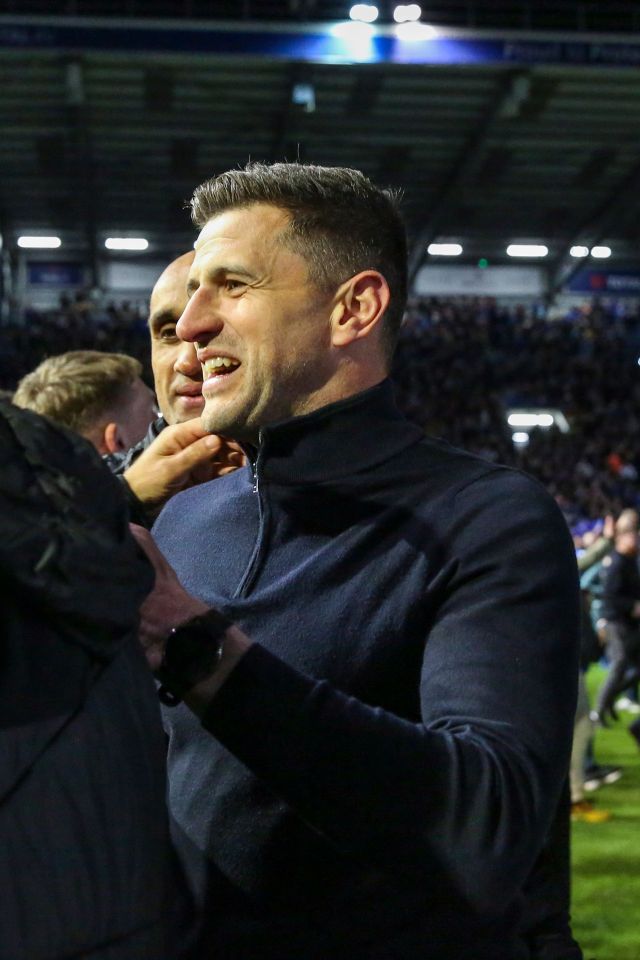 Manager John Mousinho enjoys his amazing achievement