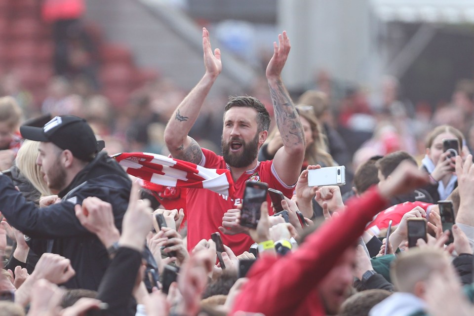 Striker Ollie Palmer celebrates with fans