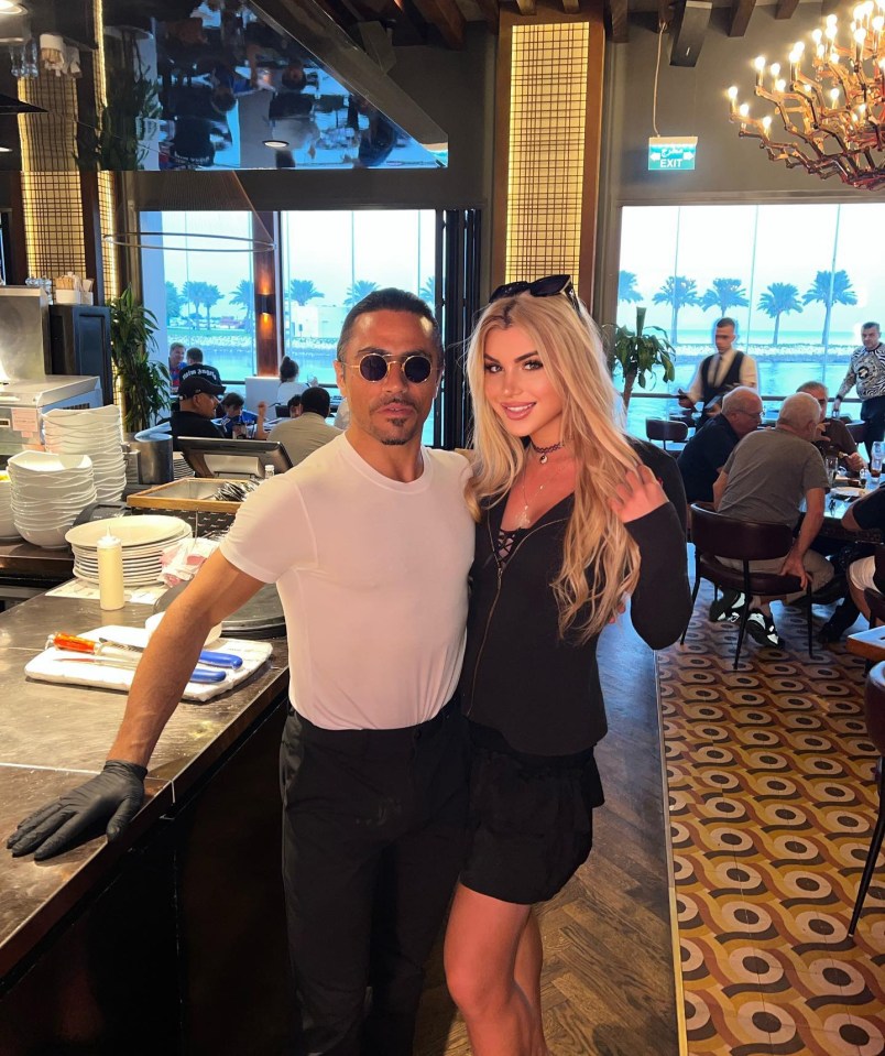 Former Miss Greece posing with Salt Bae at his restaurant