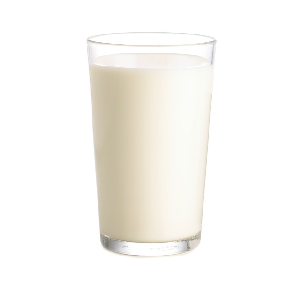 Glass of milk against a white background.