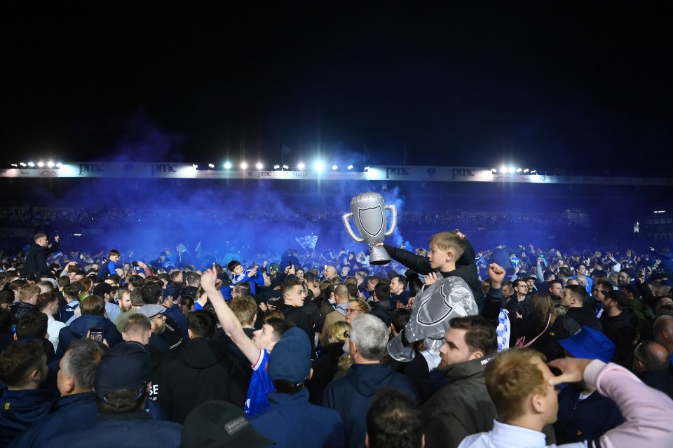 Home supporters went crazy on the pitch after the final whistle