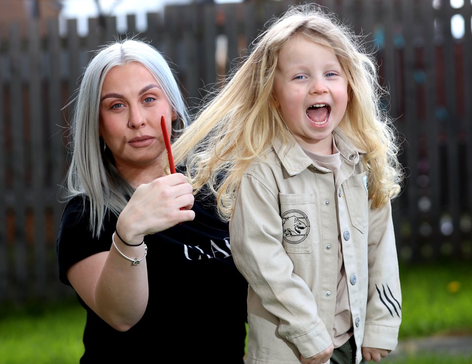 Sophie Vernon-Jones and three-year-old Kobie, showing off the length of his hair