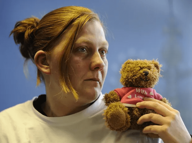 Matthews holding her daughter’s favourite teddy bear as she mades an emotional appeal for her safe return – but it was all a lie