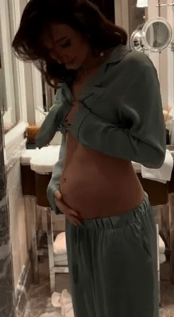 Megan has now revealed her baby bump