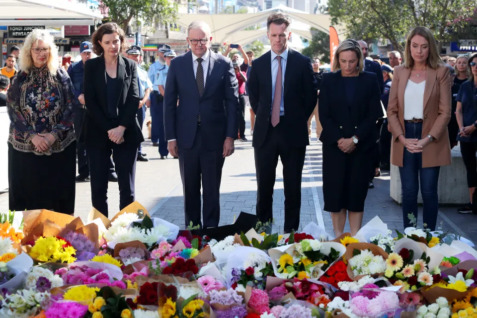 Australian PM Anthony Albanese is joined by others in laying flowers for the victims