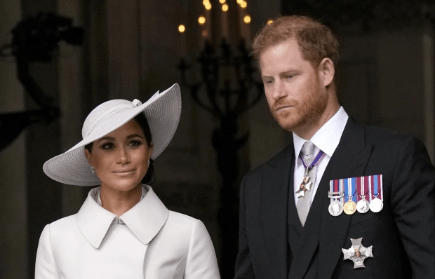 prince harry and meghan markle are standing next to each other