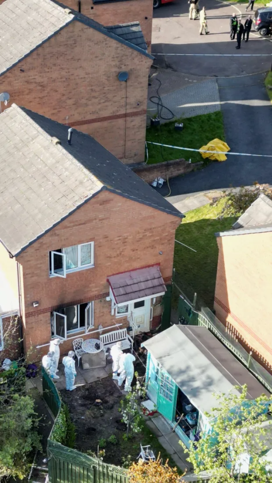 Forensic officers could be seen the back garden