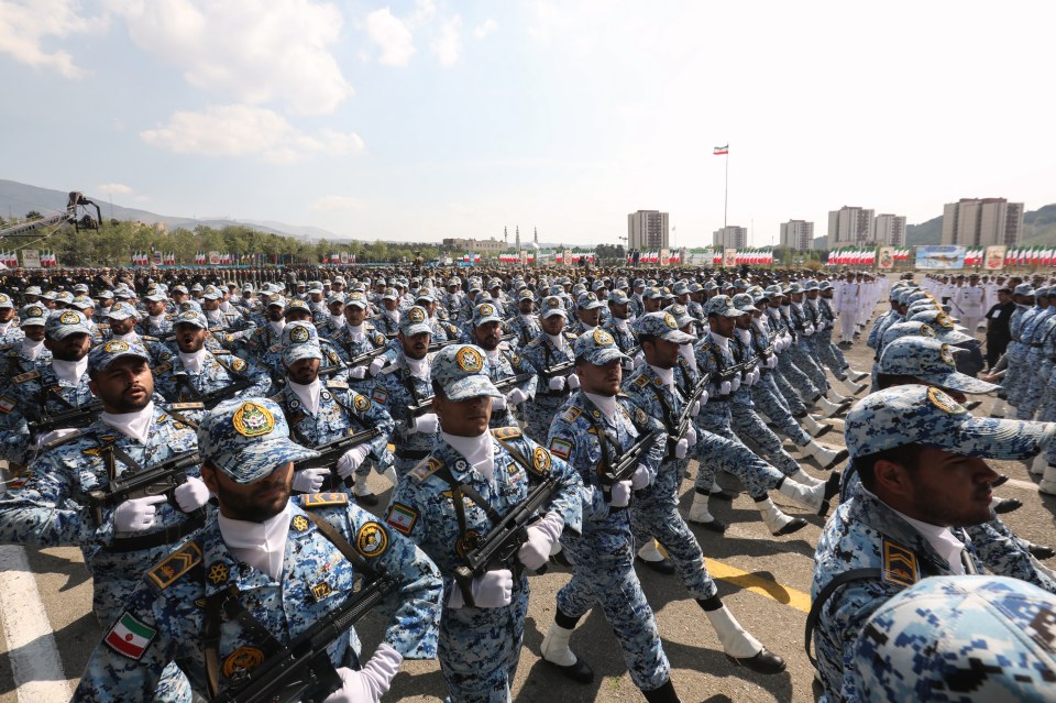 Iranian soldiers march in formation