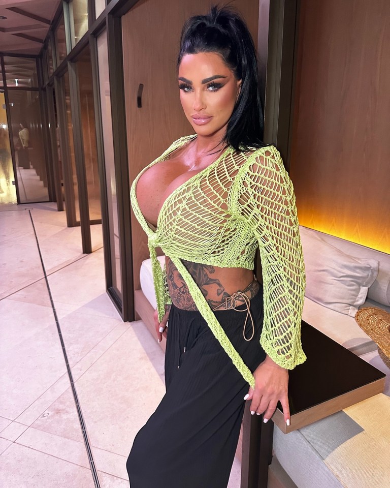 Katie Price has shown off her massive boobs in a see-through crochet shrug