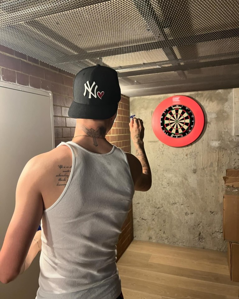 Romeo Beckham shared a picture of him practising darts with the caption: ‘@lukethenukelittler fancy a challenge?’