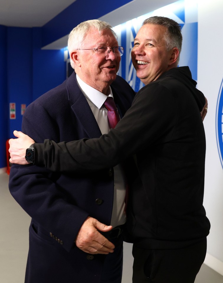 Proud Sir Alex Ferguson celebrates with his son