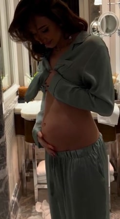 Megan showed off her bump in the video