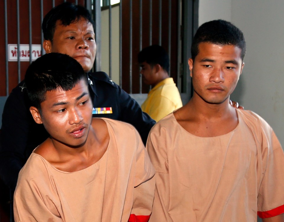 Zaw Lin (right) and Wai Phyo (left) are escorted by a Thai police officer after they were sentenced to death in 2015