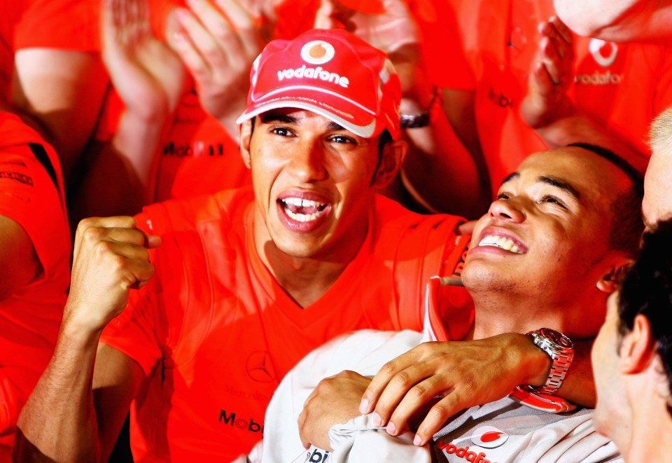 Lewis celebrating with Nicolas at the Brazilian F1 Grand Prix back in 2008