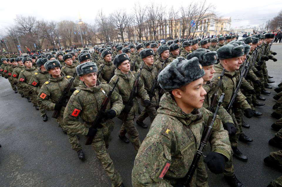 Russian military servicemen during a rehearsal for a military parade at the Dvortsovaya Palace Square in St. Petersburg