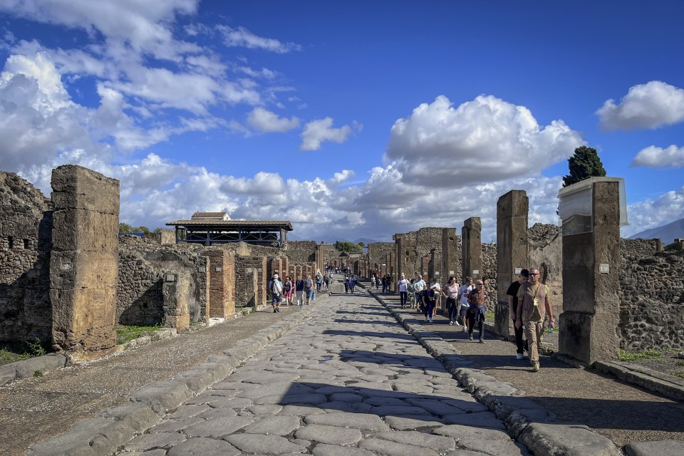 People visit the ruins of the city of Pompeii, destroyed by the eruption